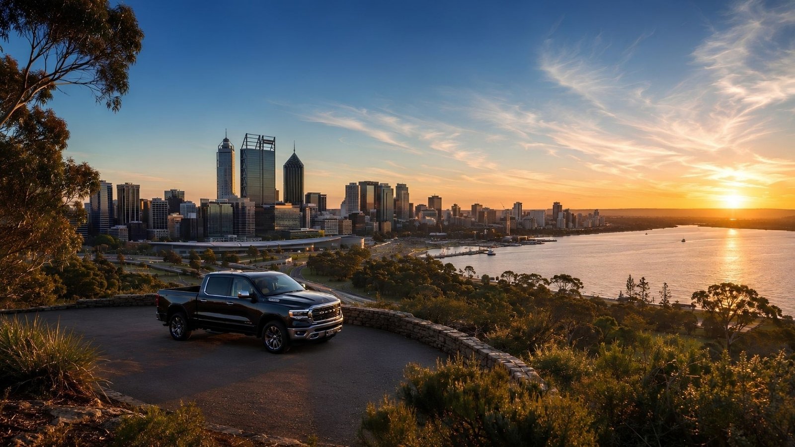 Black ute overlooking the Perth skyline at sunset