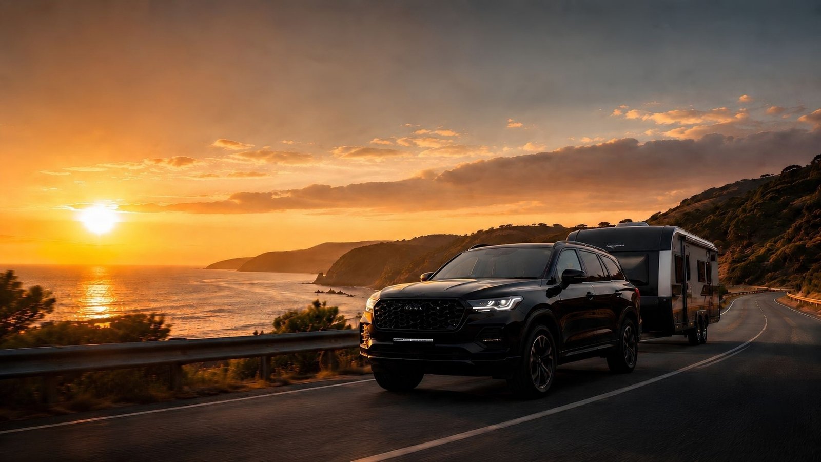 SUV towing a caravan on a coastal road at sunset