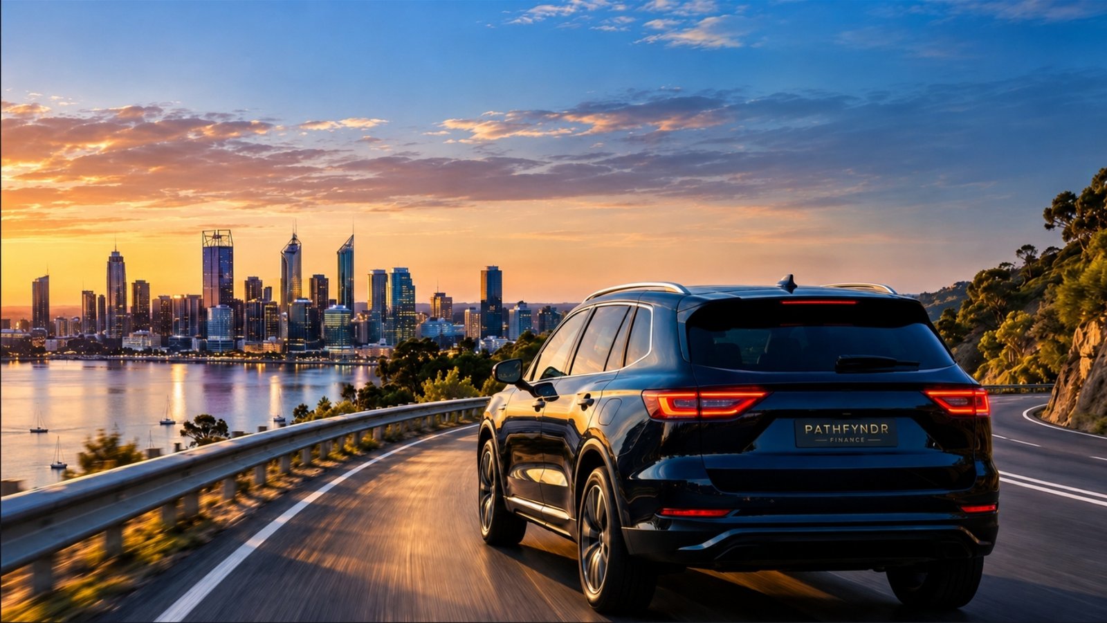 SUV on a coastal road toward the city at sunset